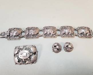 074 Lot 99 Danish sterling and 830 repousse fish parure set