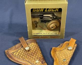 294 Lot 322h Lot of 2 leather holsters plus 1 Master gun lock