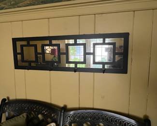 Paned mirror with coat hooks