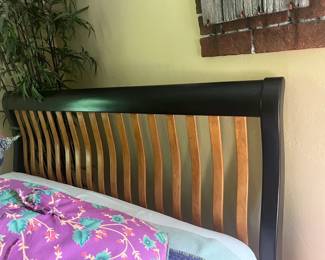 Solid black and oak sleigh bed