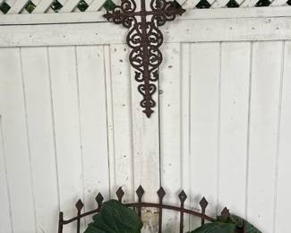 Metal cross and gate garden decor