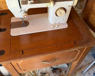 sewing machine in cabinet