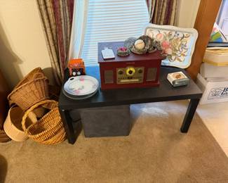 stereo, baskets, coffee table.
