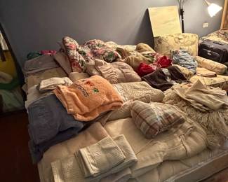 linens and bed and lamp