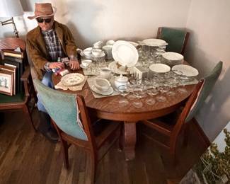 Clay man in Corner with fine china and gorgeous dining table round