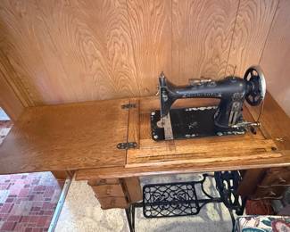 Minnesota Treadle Sewing Machine in Oak Cabinet
