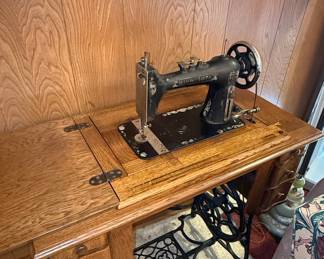Minnesota Treadle Sewing Machine in Oak Cabinet