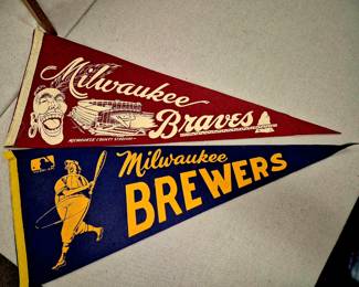 Much sports memorabilia. "Milwaukee Brewers" and "Milwaukee Braves"