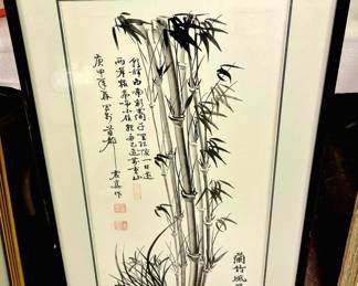 Framed Asian ink depicting bamboo stalks