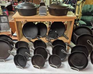 Large selection of cast iron cookware.