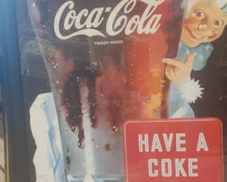 several vintage Coke advertising pieces
