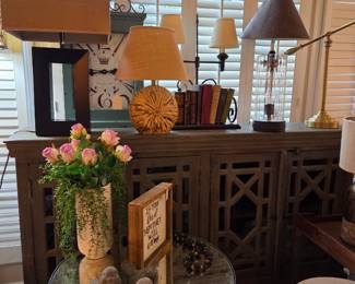 beautriful wood 4 door credenza wirth various lamps plus small tables and decor