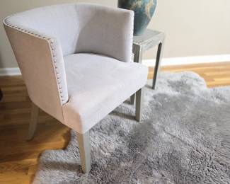 sheep skin large with gromut chair and pottery
