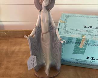 A19 - $55. Lladro Hand Painted "Afternoon Tea" Porcelain Figurine with box. Measures 14.25" tall. Missing a tiny flower on her hat - you wouldn't know unless you were looking.