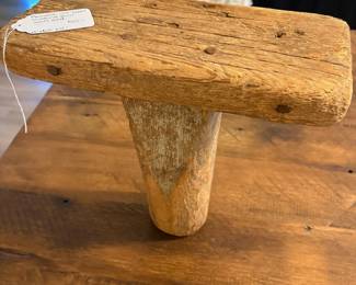 A60 - $50. Primitive One-Legged Milking Stool turned into a wall shelf. Measures 12" x 5.5" x 12" tall.