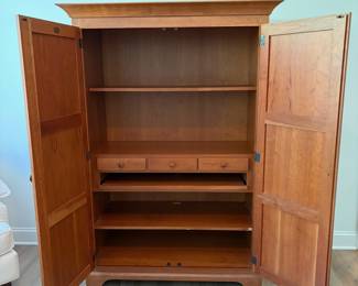A7 - $400. Arhaus Furniture Shaker Style Cherry Wood Armoire. Measures 47.5" x 25.25" x 68" tall. The outside is in very good condition - the inside shows the most wear. Beautiful piece - not oversized!