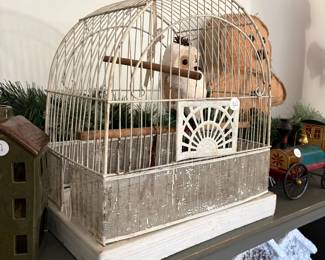 A81 - $30. Decorative Bird Cage. Measures 14" x 9.5" x 14.75" tall.