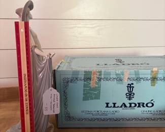A19 - $55. Lladro Hand Painted "Afternoon Tea" Porcelain Figurine with box. Measures 14.25" tall. Missing a tiny flower on her hat - you wouldn't know unless you were looking.