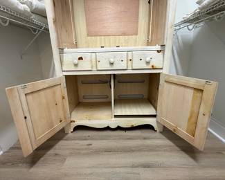 A49 - $100. Solid Wood Armoire with whitewash finish and floral design. Measures 43.75" x 22.25" x 76" tall. Doors slide into the cabinet.