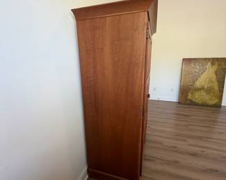 A7 - $400. Arhaus Furniture Shaker Style Cherry Wood Armoire. Measures 47.5" x 25.25" x 68" tall. The outside is in very good condition - the inside shows the most wear. Beautiful piece - not oversized!
