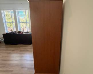 A7 - $400. Arhaus Furniture Shaker Style Cherry Wood Armoire. Measures 47.5" x 25.25" x 68" tall. The outside is in very good condition - the inside shows the most wear. Beautiful piece - not oversized!