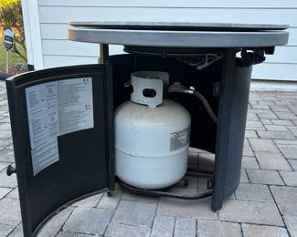A36 - $60. Garden Treasures Propane Fire Pit with Enduro Top Lid.