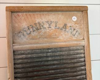 A57 - $25. Sunnyland Antique Washboard. Measures 12.5" x 24" tall.