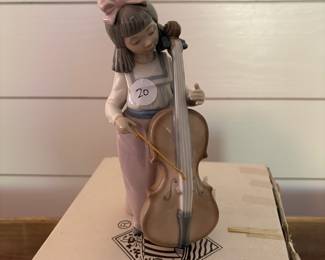 A22 - $20. Nao for Lladro. Girl with Cello. No issues noted - includes original box. 7.25" tall.