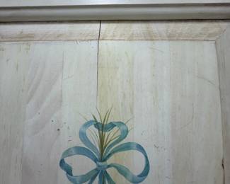 A49 - $100. Solid Wood Armoire with whitewash finish and floral design. Measures 43.75" x 22.25" x 76" tall. Doors slide into the cabinet.