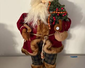 A86 - $25. Decorative Santa. Measures 25" tall.