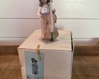 A22 - $20. Nao for Lladro. Girl with Cello. No issues noted - includes original box. 7.25" tall.