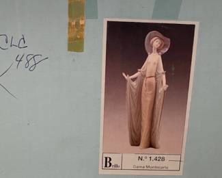 A19 - $55. Lladro Hand Painted "Afternoon Tea" Porcelain Figurine with box. Measures 14.25" tall. Missing a tiny flower on her hat - you wouldn't know unless you were looking.
