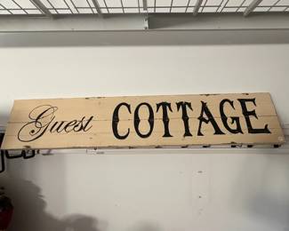 A85 - $25. Guest Cottage Wooden Sign. Measures 50" x 10" tall.
