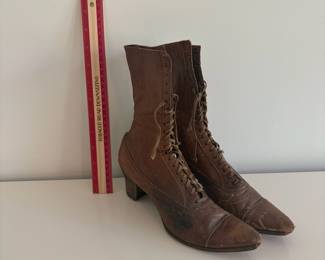 A48 - $20. Antique Lace Up Boots for display.