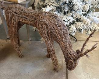 A66 - $125. Wicker Reindeer & Sleigh. Reindeer is 50" x 14" x 32" tall. Wicker Sleigh. Measures 47" x 20" x 33" tall.