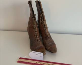 A48 - $20. Antique Lace Up Boots for display.