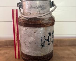A14 - $40. 10L Metal Milk Can / (Milchkanne). Measures 9" across x 14.5" tall.