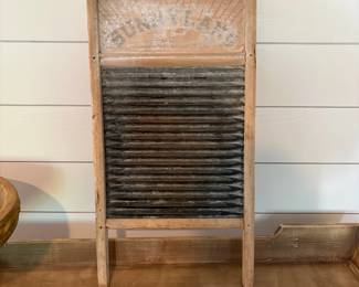 A57 - $25. Sunnyland Antique Washboard. Measures 12.5" x 24" tall.