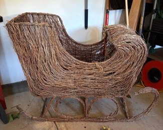 Wicker Sleigh. Measures 47" x 20" x 33" tall.