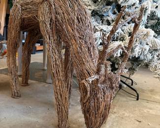 A66 - $125. Wicker Reindeer & Sleigh. Reindeer is 50" x 14" x 32" tall. Wicker Sleigh. Measures 47" x 20" x 33" tall.