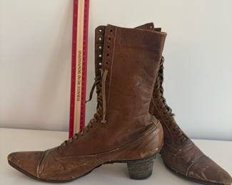 A48 - $20. Antique Lace Up Boots for display.