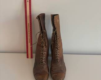 A48 - $20. Antique Lace Up Boots for display.