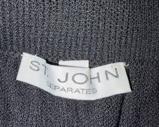 A96 - $45. Black St. John Knit Skirt. Size 6 Waistband elastic is bent.