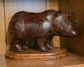 hand-carved wooden rhinoceros sculpture