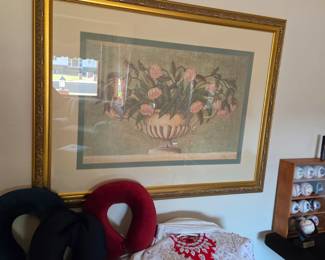 Large gold-framed floral artwork