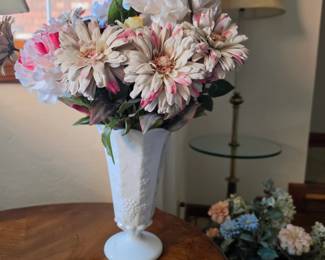 Milk glass vase with artificial floral arrangement