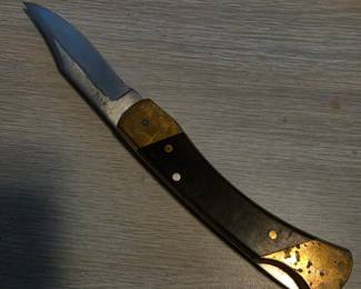 Schrade+ USA LB7 Bear Paw locking folding knife, with wood handles, brass bolsters, and its original Schrade leather sheath