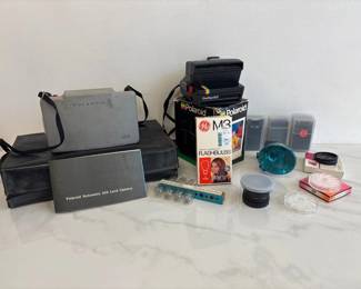 Lot 8699 Vintage Polaroid Cameras and Accessories