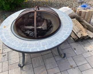 Metal Outdoor Fireplace And Wood To Go With It