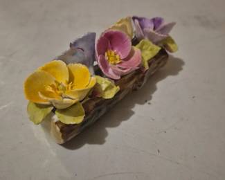 Floral on a log